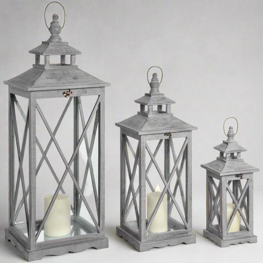 Set Of Three Wooden Lanterns With Traditional Cross Section